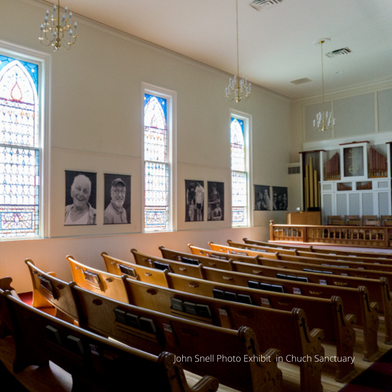 photography exhibit inside church sanctuary