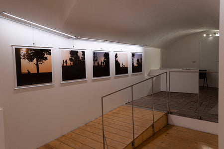 Roberto Bocci photo exhibit installed with The Original Posterhanger in a gallery in Italy